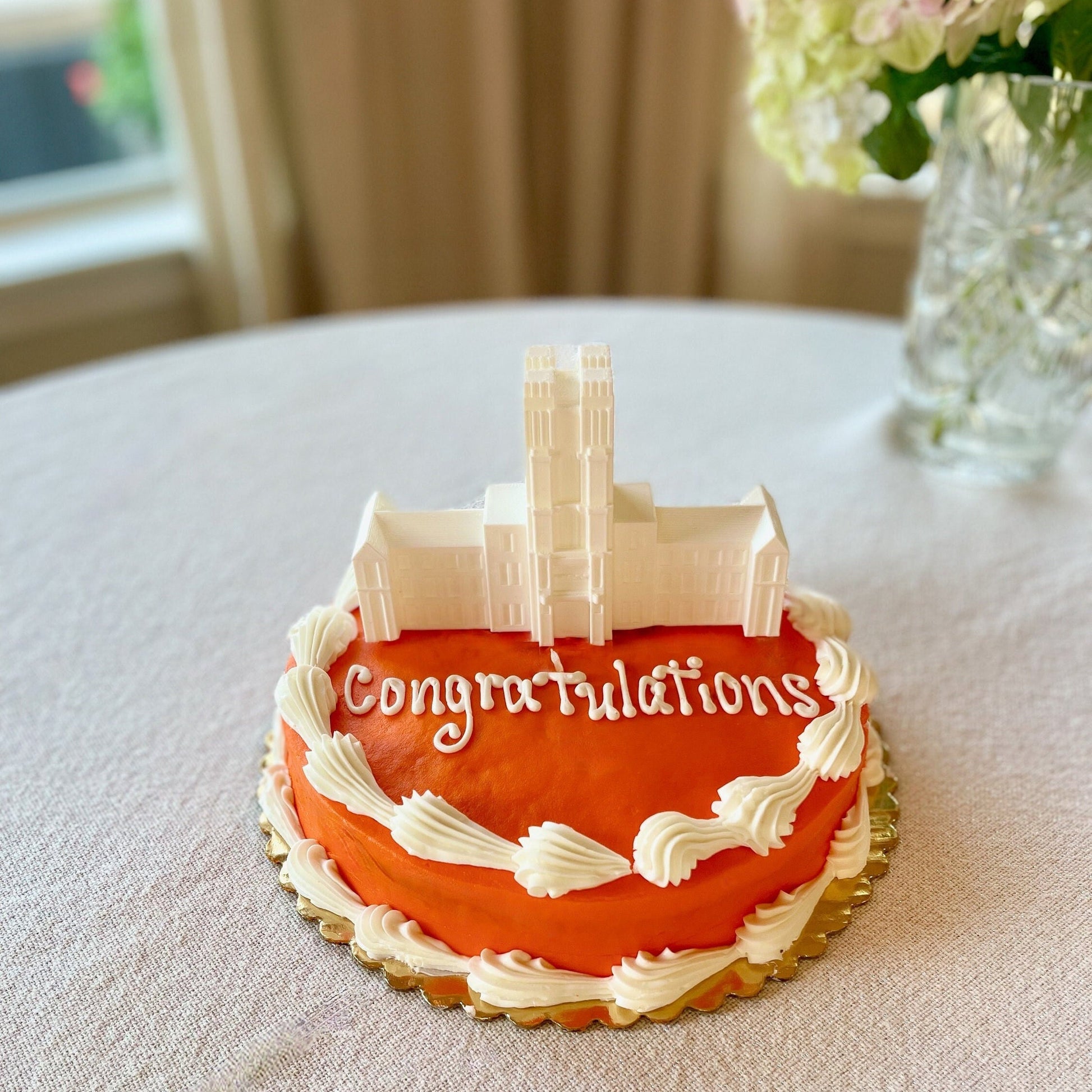 The Virginia Tech 3D printed figurine, shown on a Virginia Tech graduation cake.