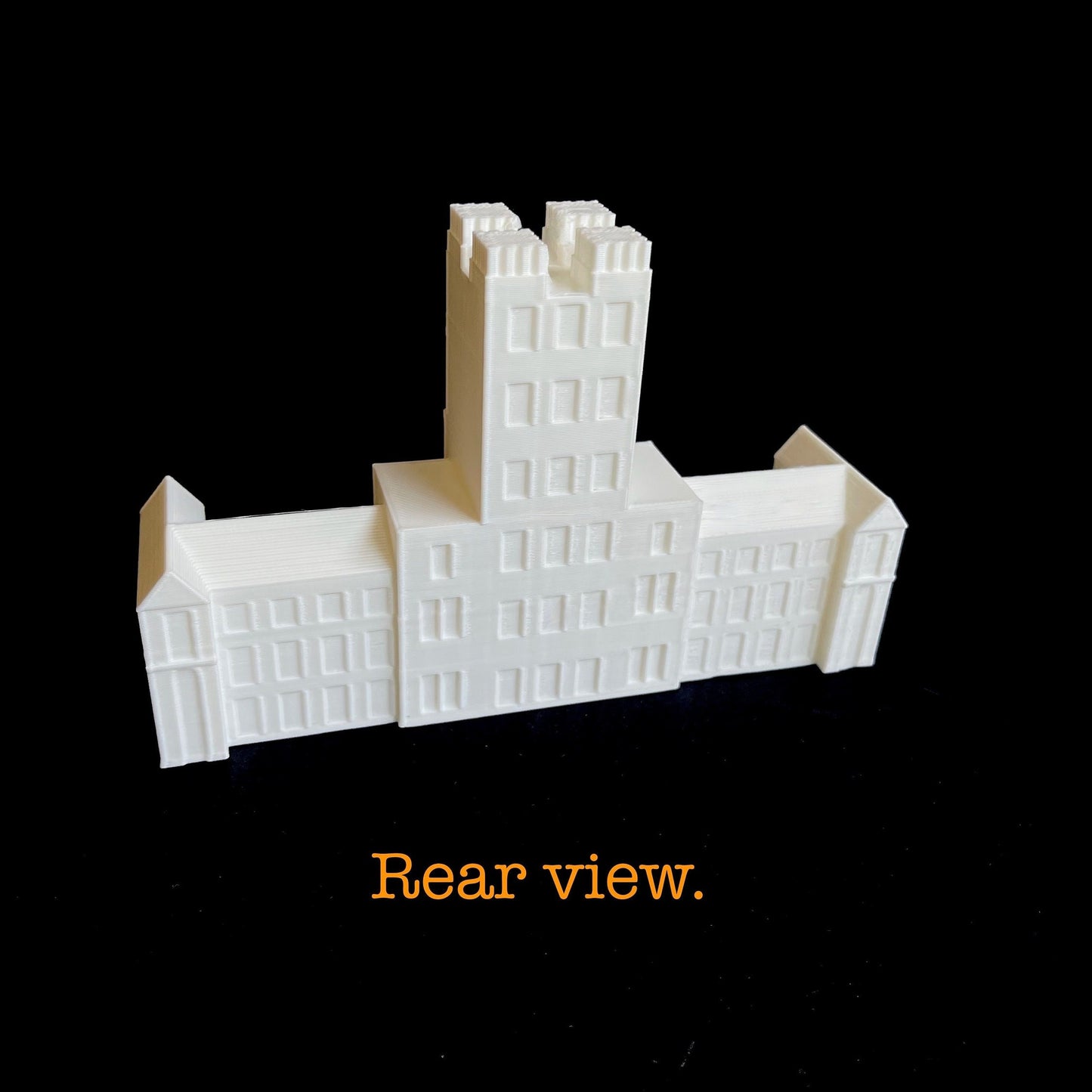 Rear view of the Virginia Tech figurine, designed as a replica of Burruss Hall.