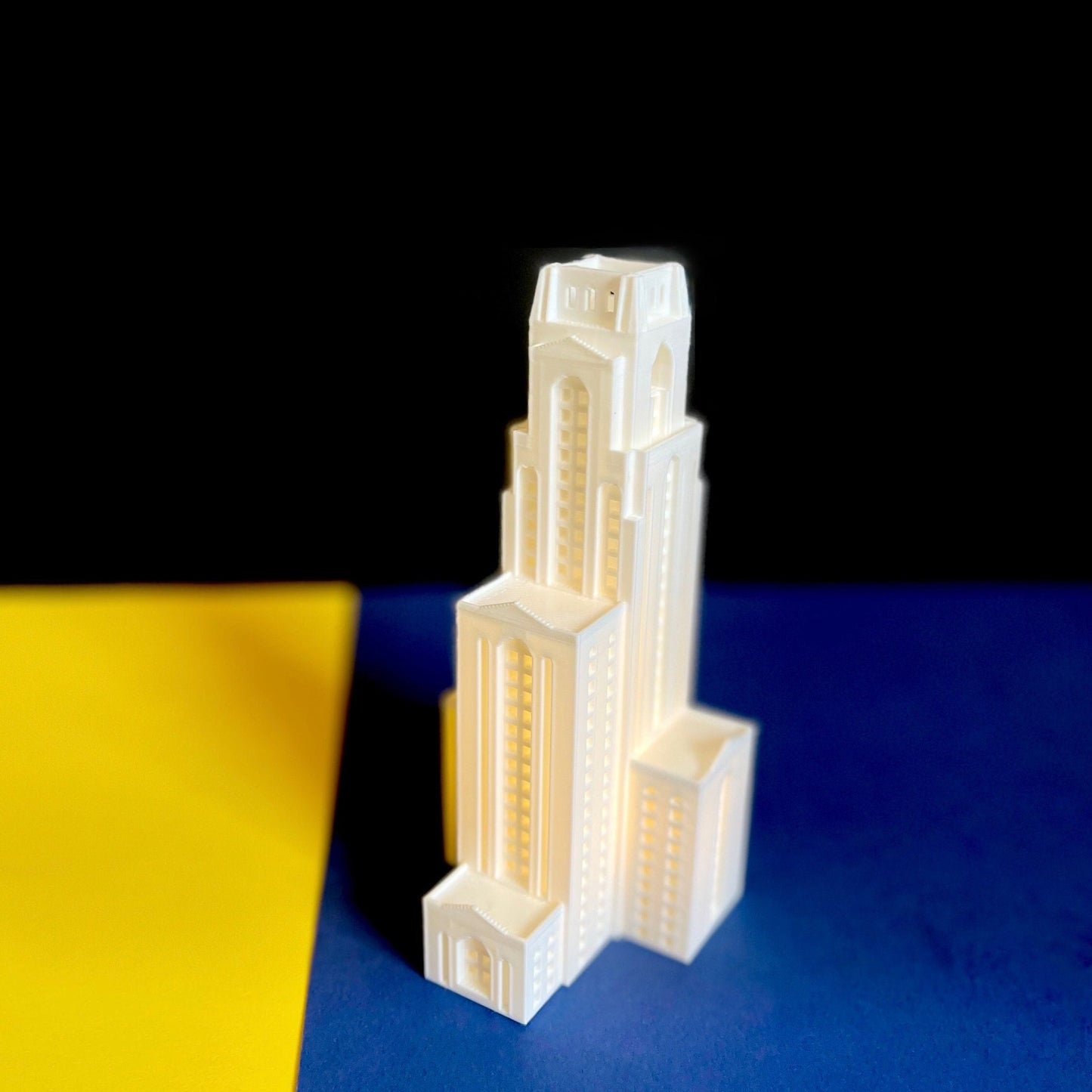 The University of Pittsburgh cake topper, shown in detail and design as a replica of the Pitt Cathy.