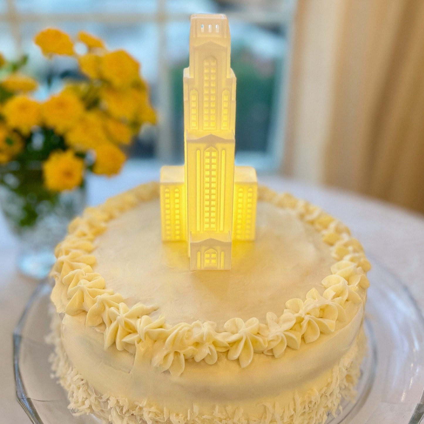 The Pitt cake topper, shown on a University of Pittsburgh graduation cake.