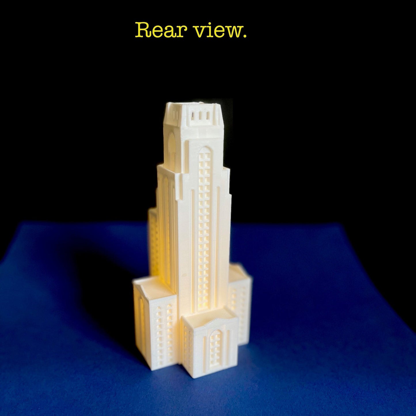 Rear view of the lighted Pitt Cathedral of Learning gift for a student.