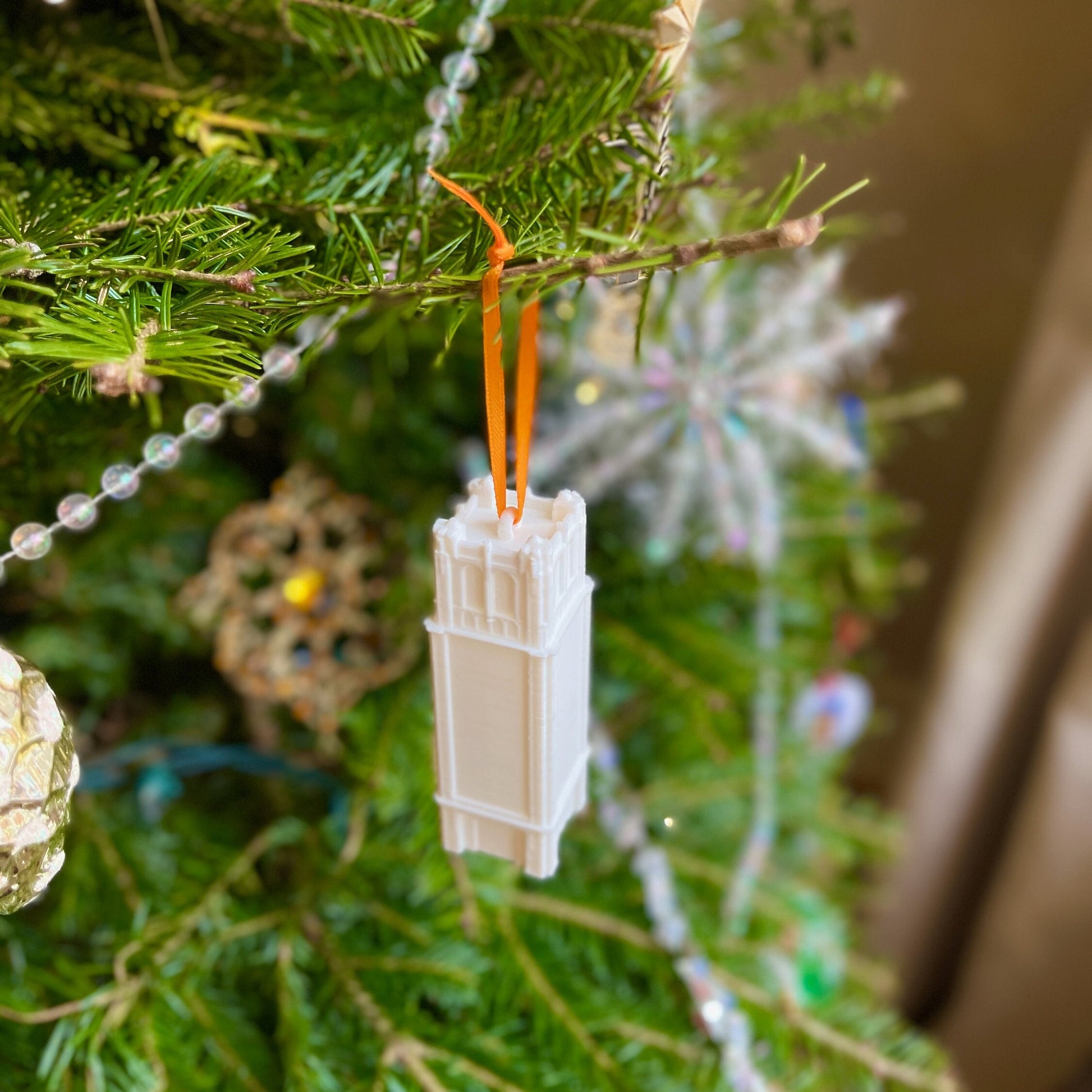 The University of Florida ornament, shown on a Christmas tree.