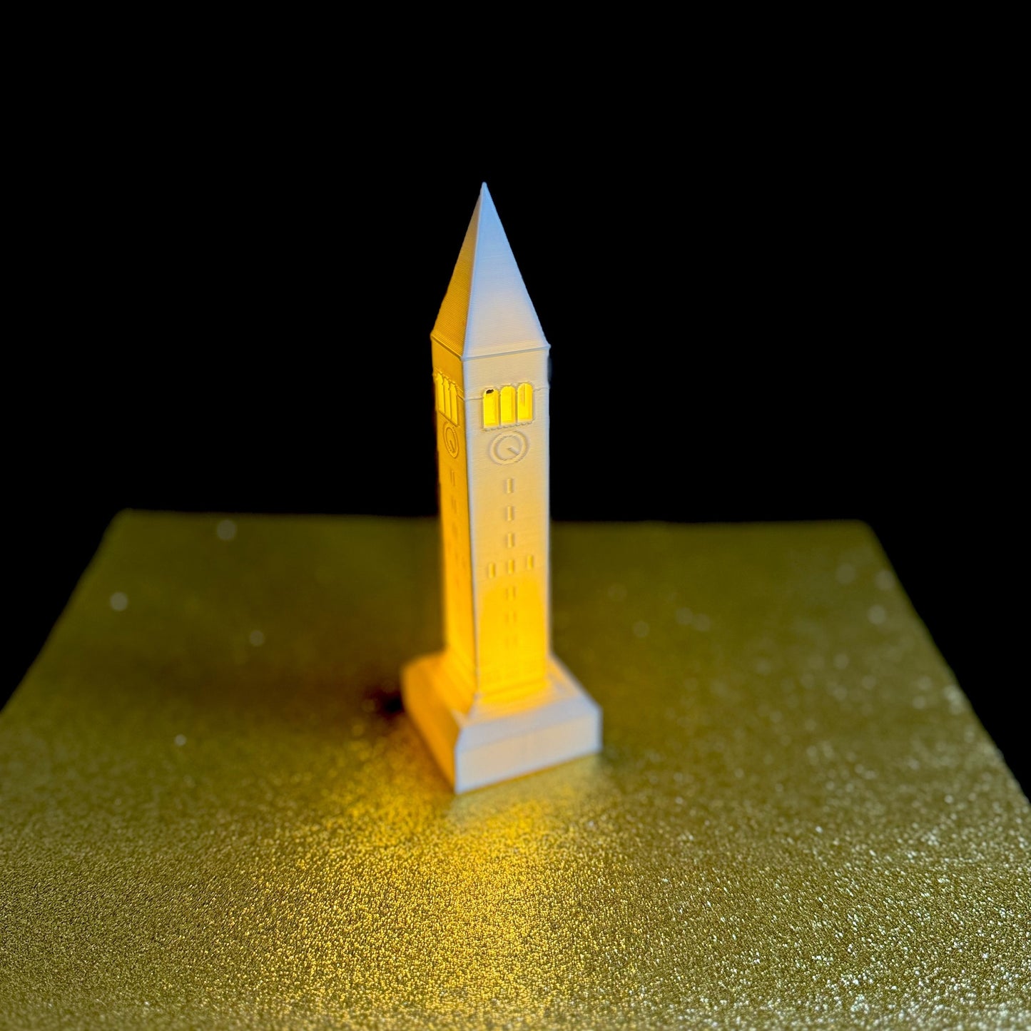 The Cornell McGraw Tower light, shown against a black background.