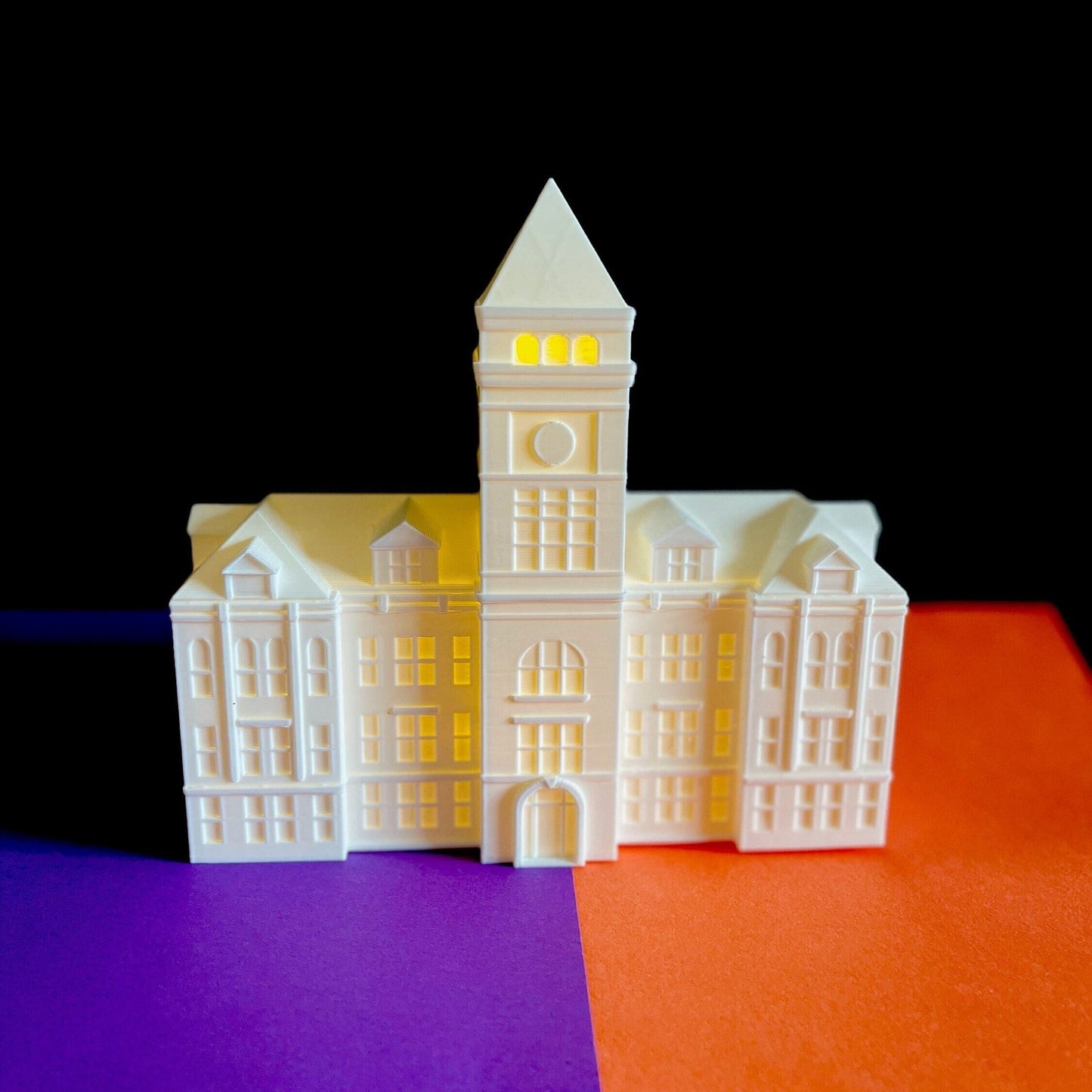 The Clemson Hall campus figurine, designed as a replica of Clemson's Tilllman Hall.