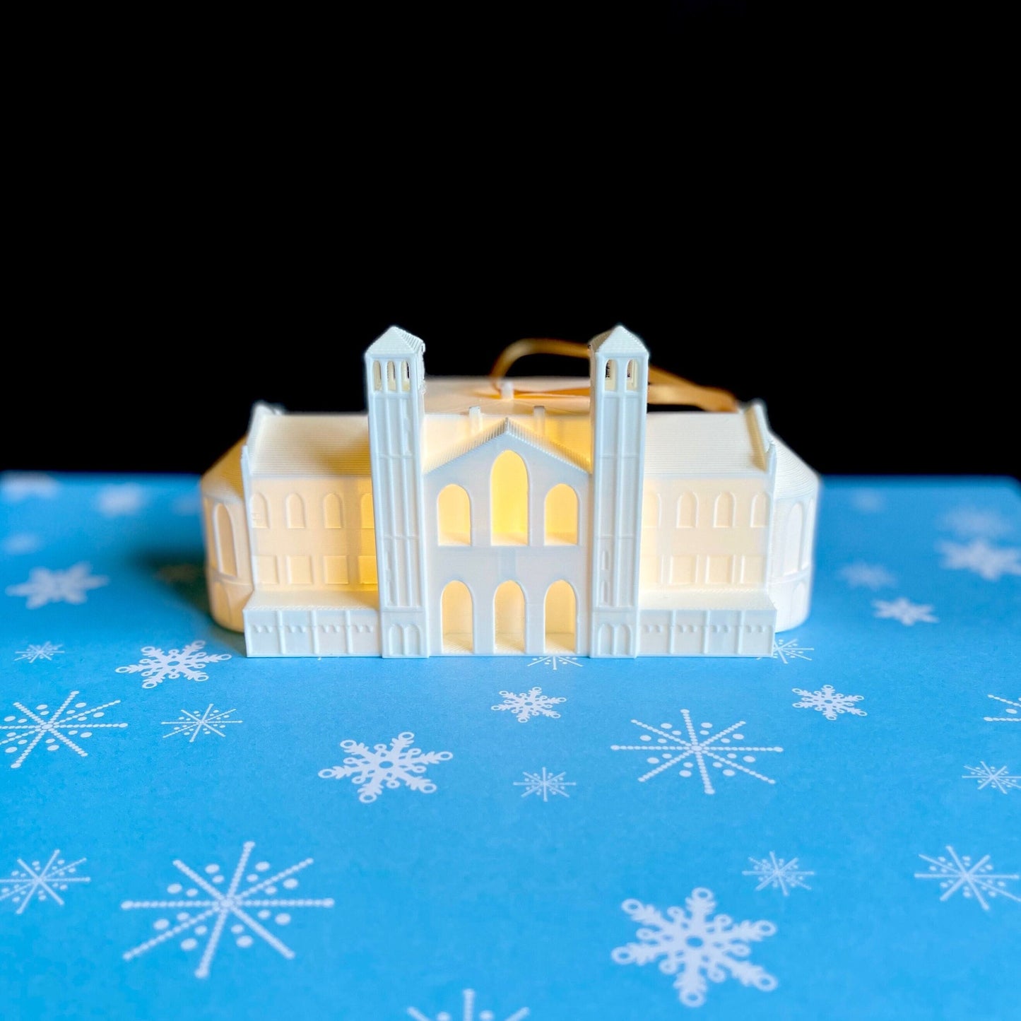 The lighted UCLA ornament, designed as a replica of Royce Hall.