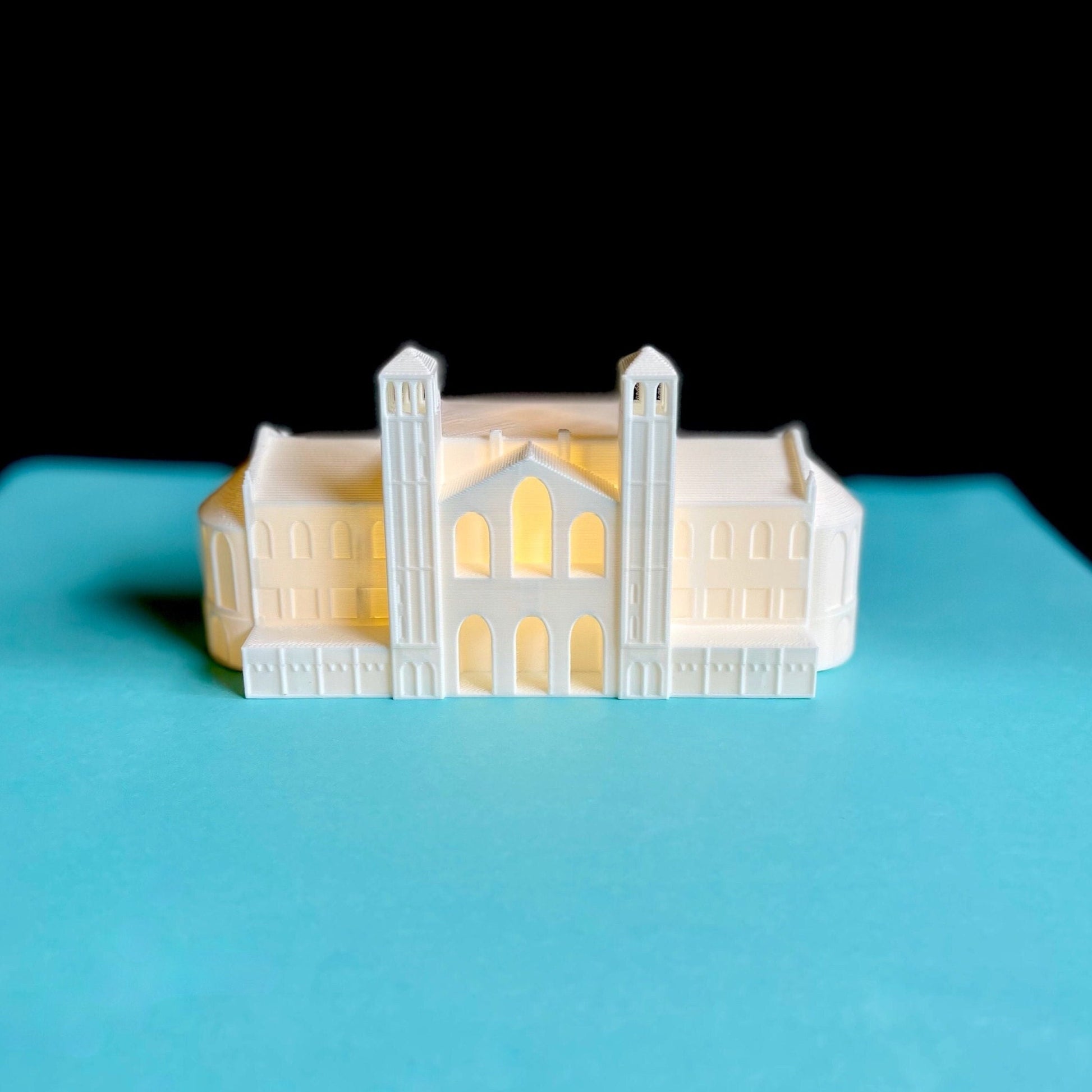 The lighted UCLA cake topper, designed as a replica of Royce Hall.