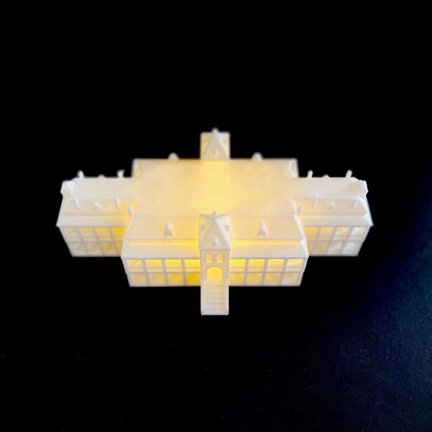 Top view of the lighted university of arizona figurine, designed as a replica of the old main campus building.