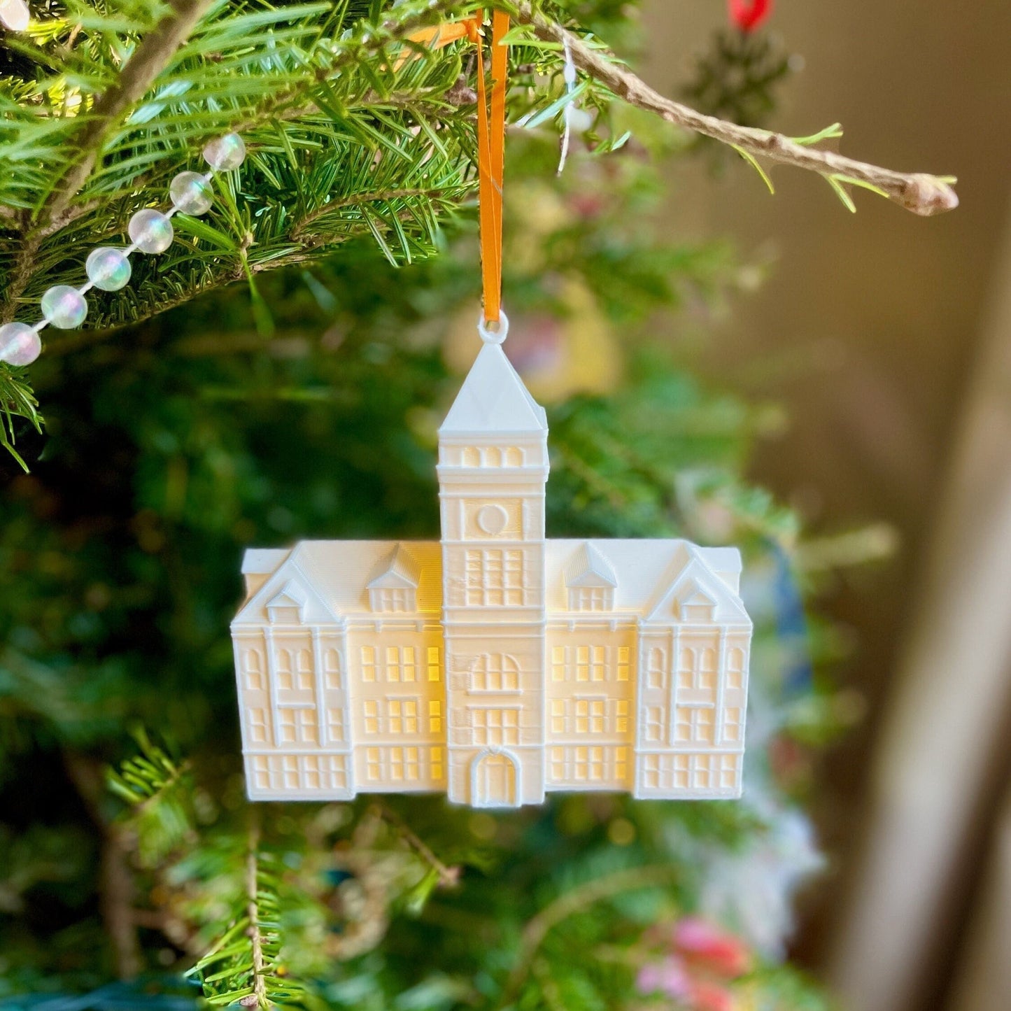 The lighted Clemson University ornament, designed as a replica of Tillman Hall.