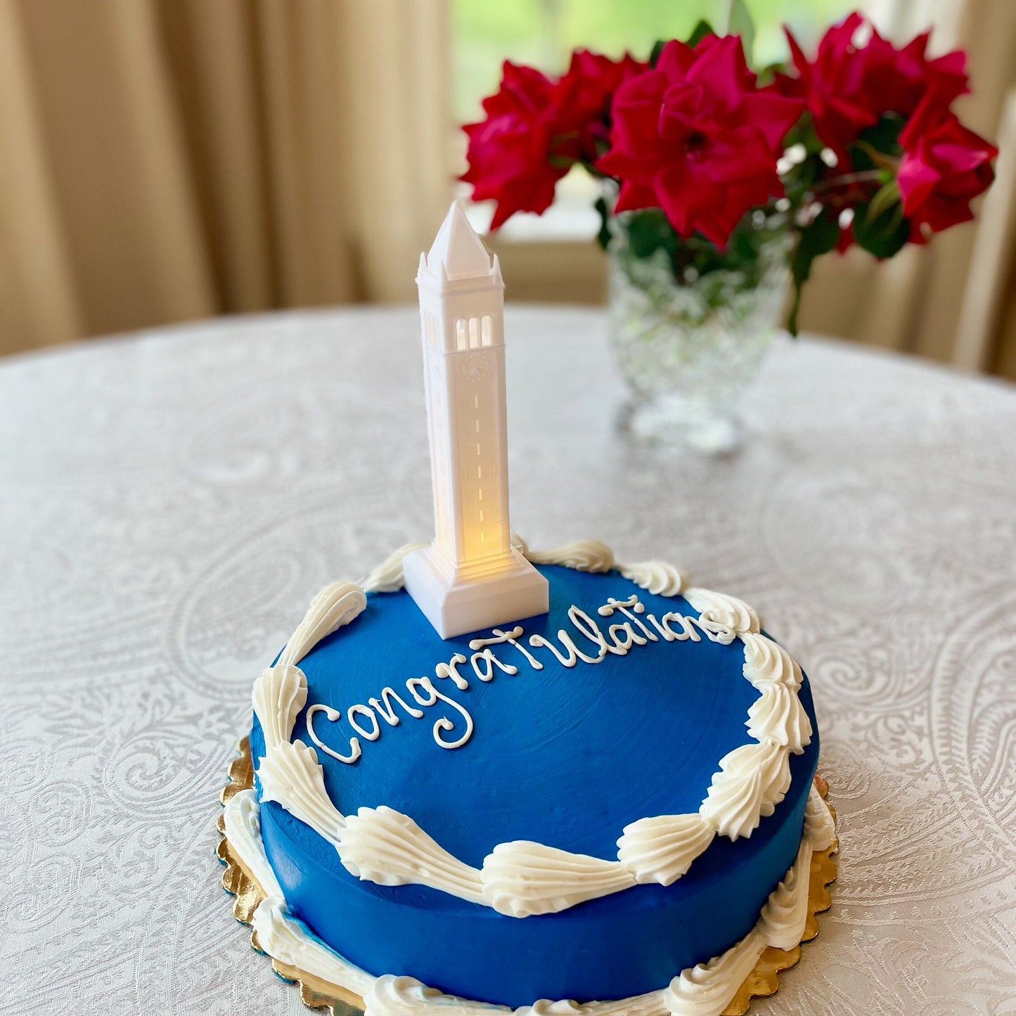 The lighted Berkeley cake topper figurine, a replica of the Berkley Campanile.