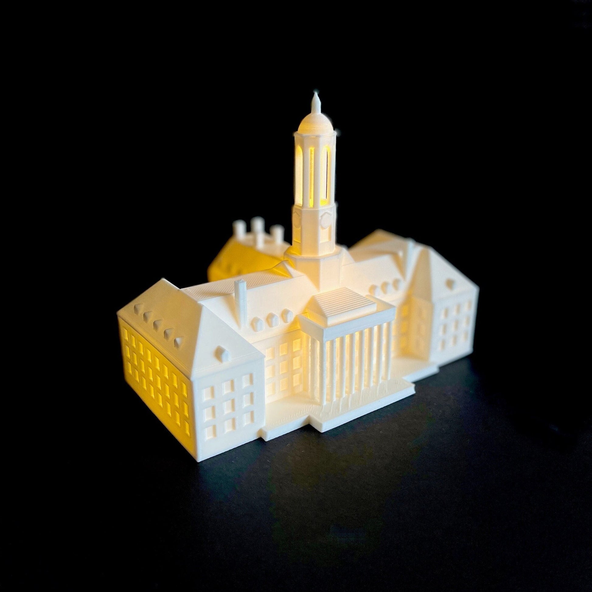 The lighted Penn State figurine, designed as a replica of the Penn State Old Main building.