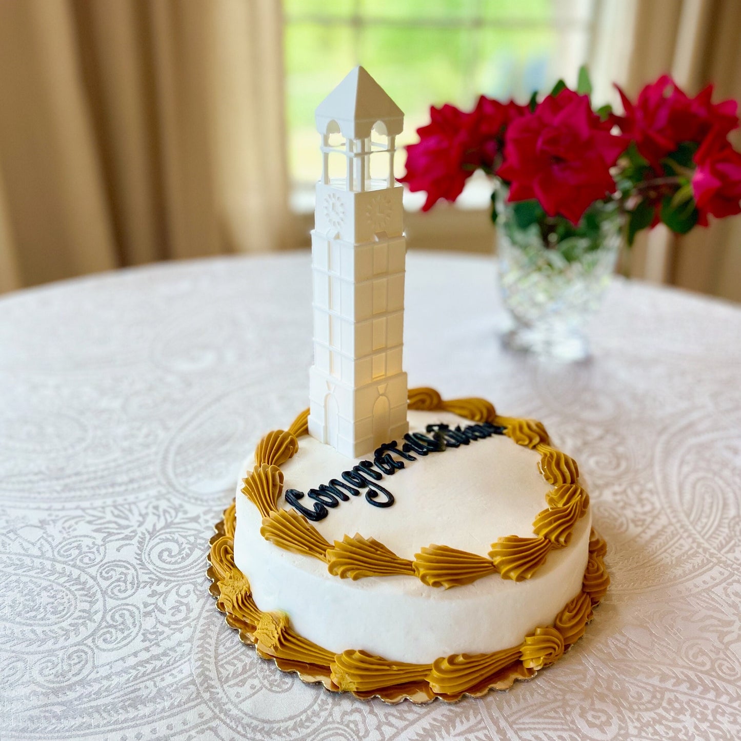 The Boilermakers cake topper, shown on a Purdue graduation cake.