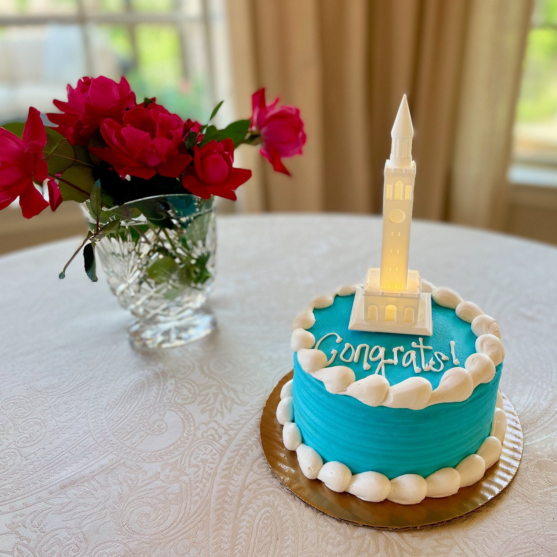 The UNC graduation party decoration, used as a cake topper on a UNC graduation cake.