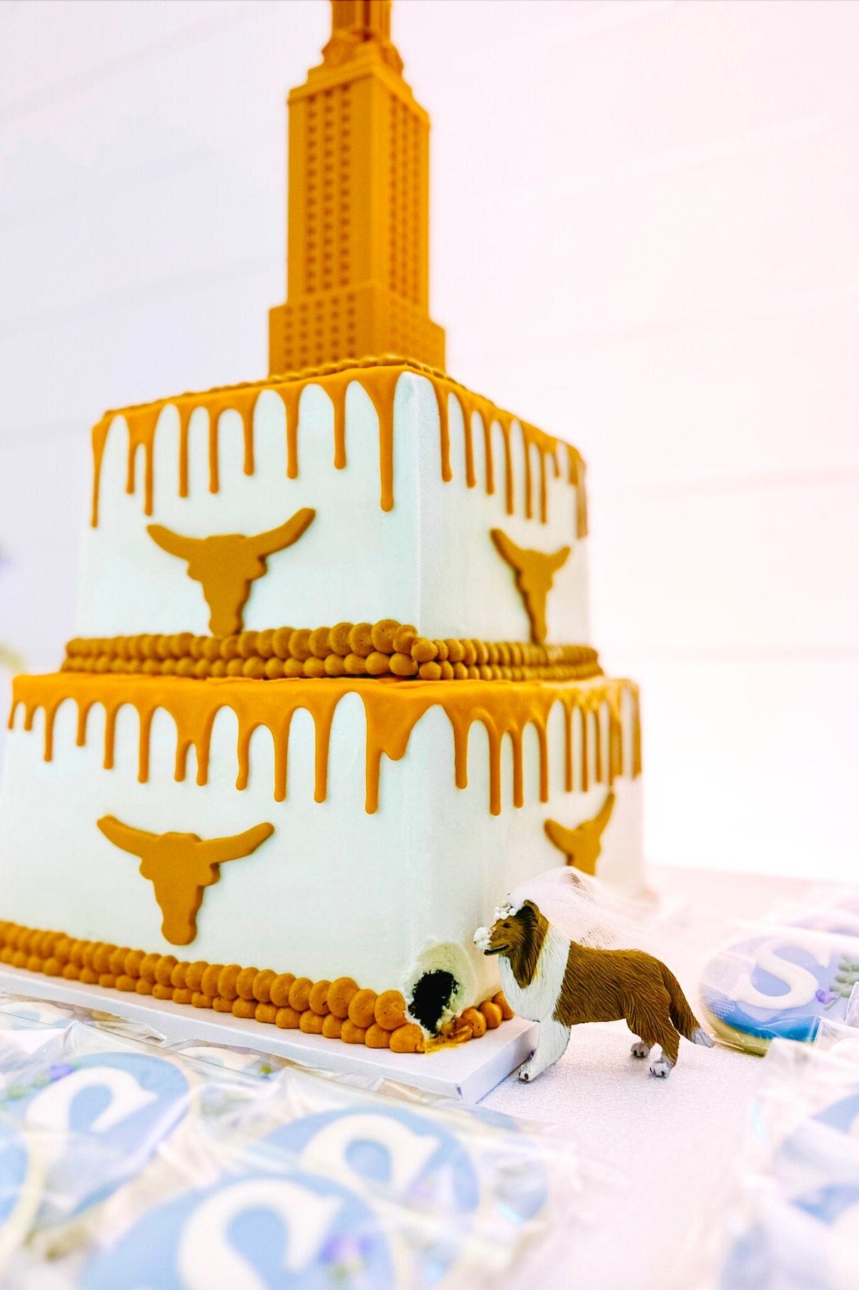 The UT Tower figurine, shown in use as a University of Texas cake topper on a UT groom's cake.