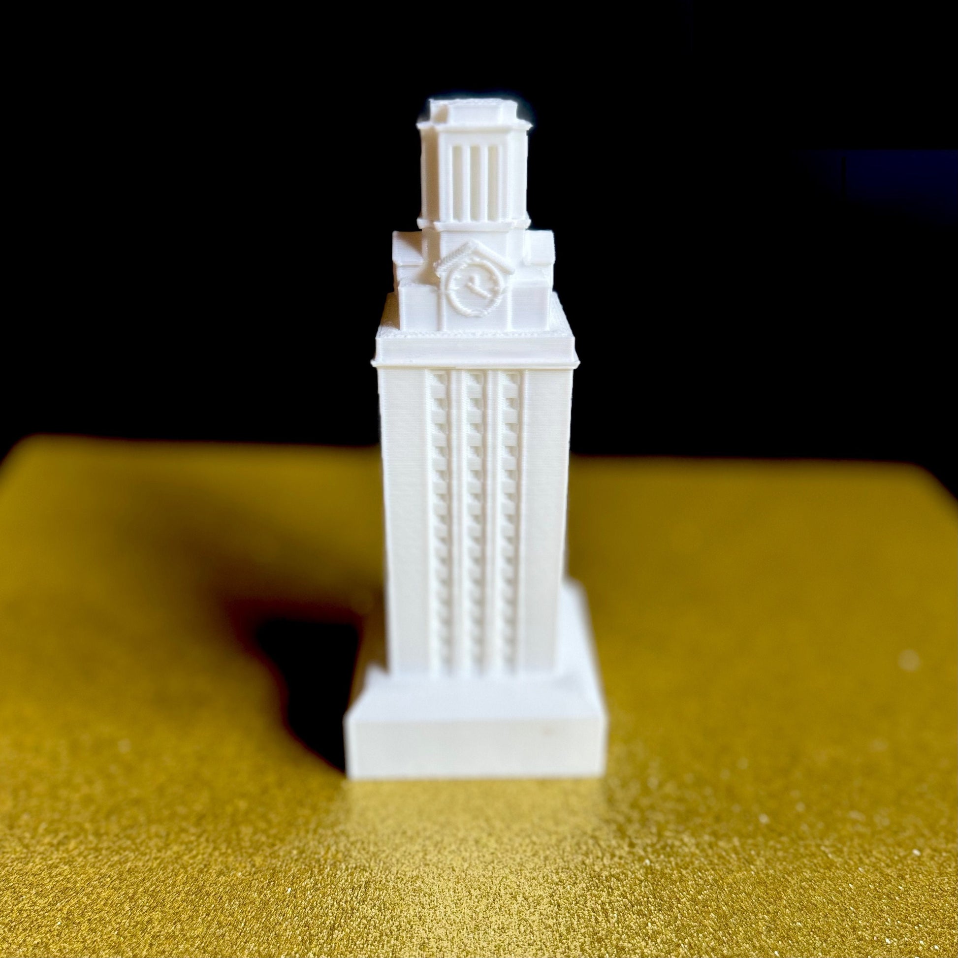 Front view of the white University of Texas Longhorns figurine, designed in honor of the UT Tower.