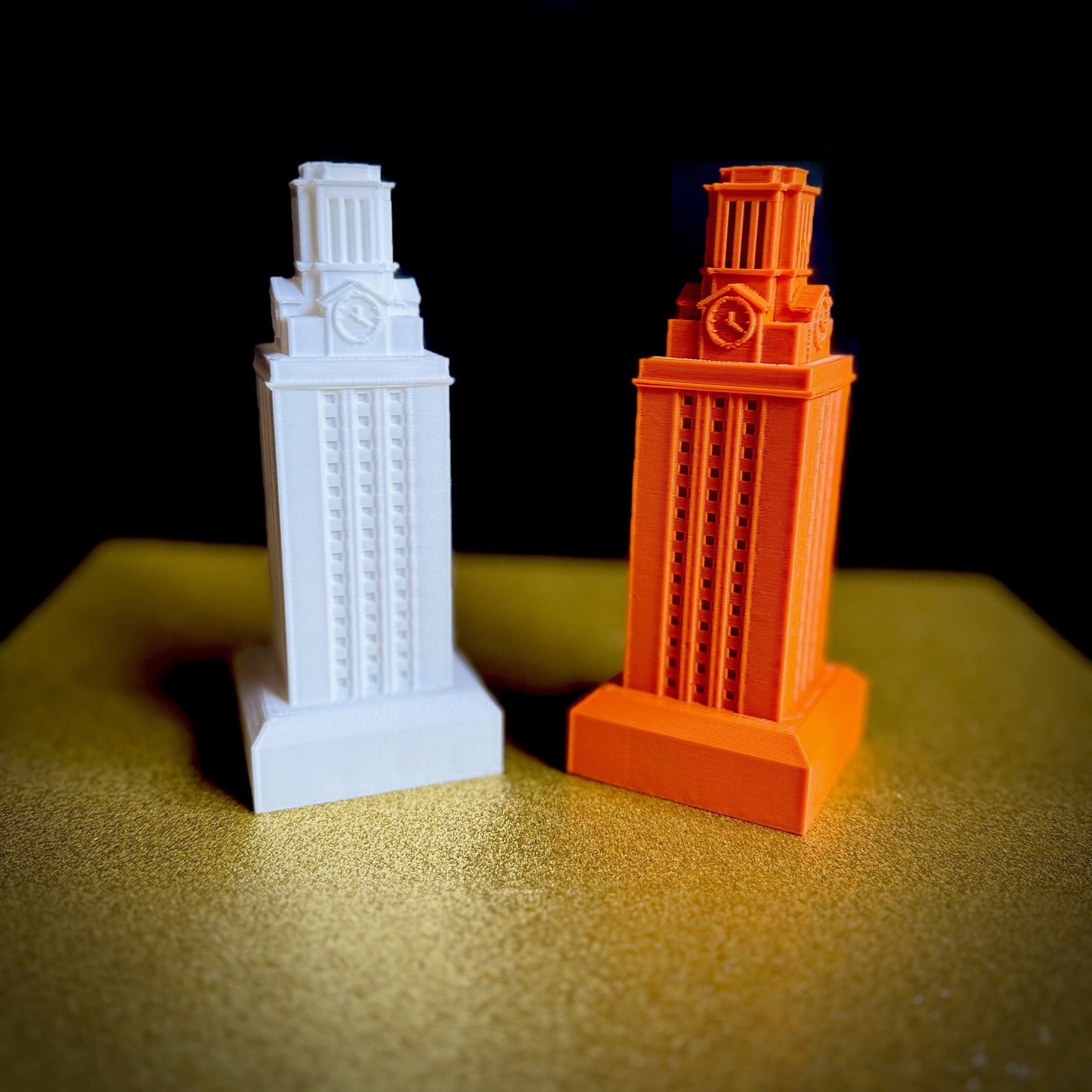 The UT Tower figurines, shown in white and burnt orange.