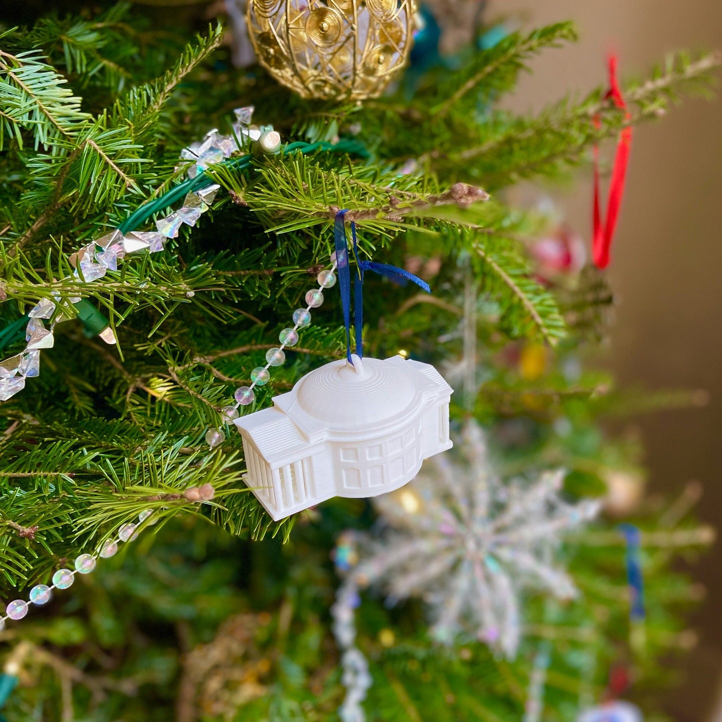 The UVA stocking stuffer ornament, designed as the UVA Rotunda.