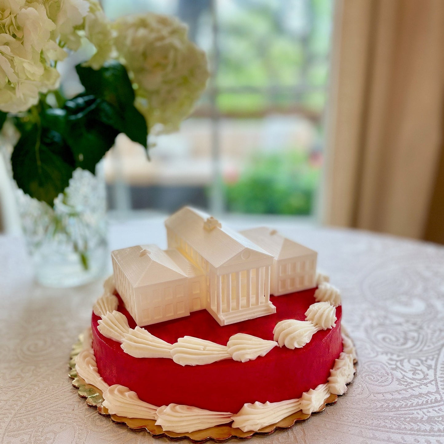 The Ole Miss cake topper figurine, shown on an Ole Miss cake.