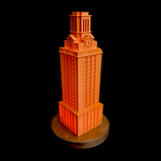 The lighted burnt orange UT Tower lamp.