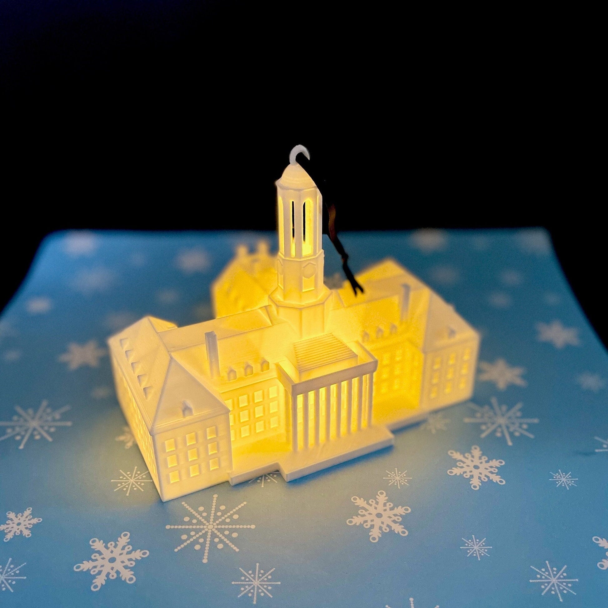 The lighted Penn State ornament, designed in honor of the Old Main building.