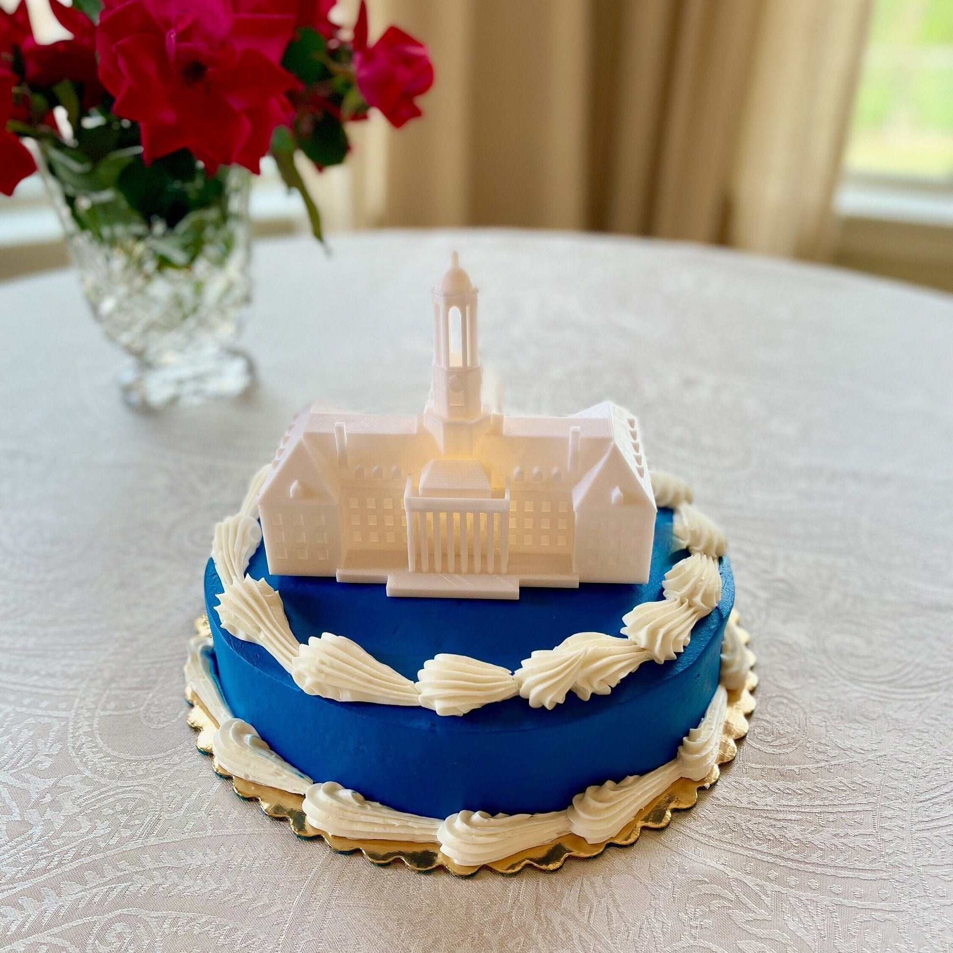 The lighted Penn State cake topper, designed as a replica of the Penn State Old Main.