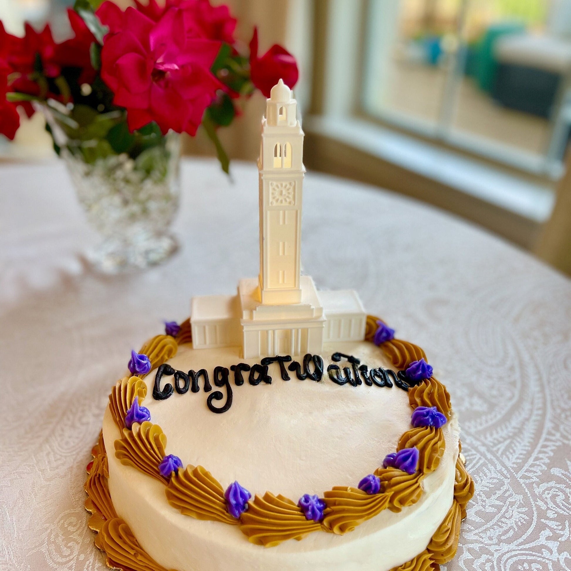 The lighted LSU cake topper, shown on an LSU graduation cake.