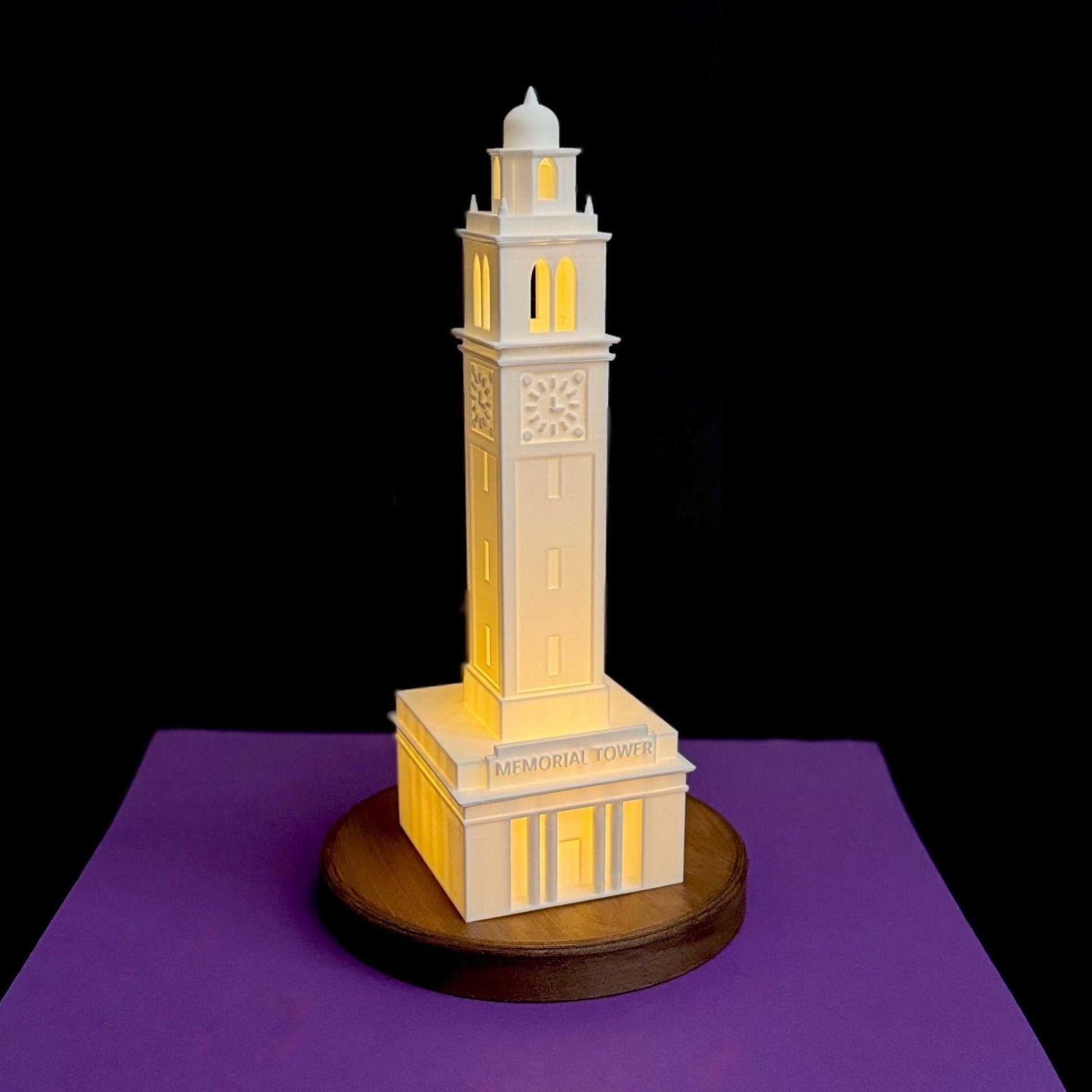 The LSU Memorial Tower lamp, shown against a purple background.