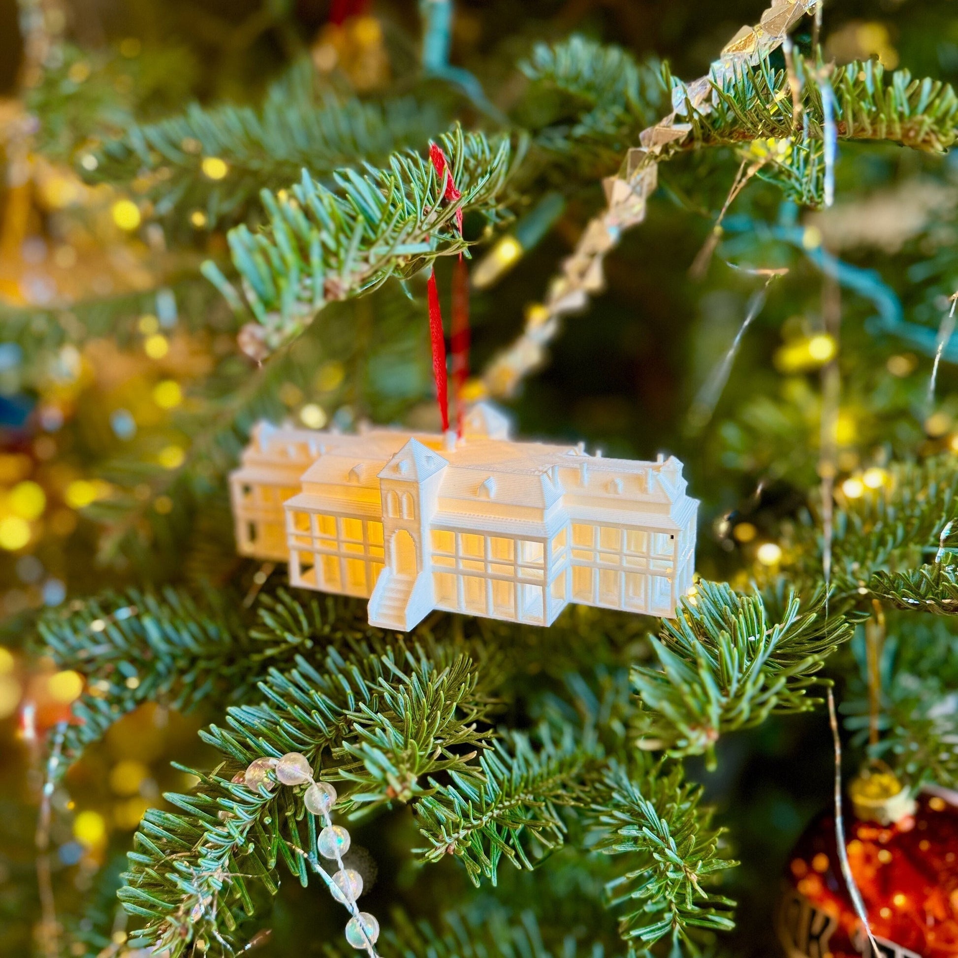 The lighted University of Arizona ornament, designed in honor of the Arizona Old Main Building.