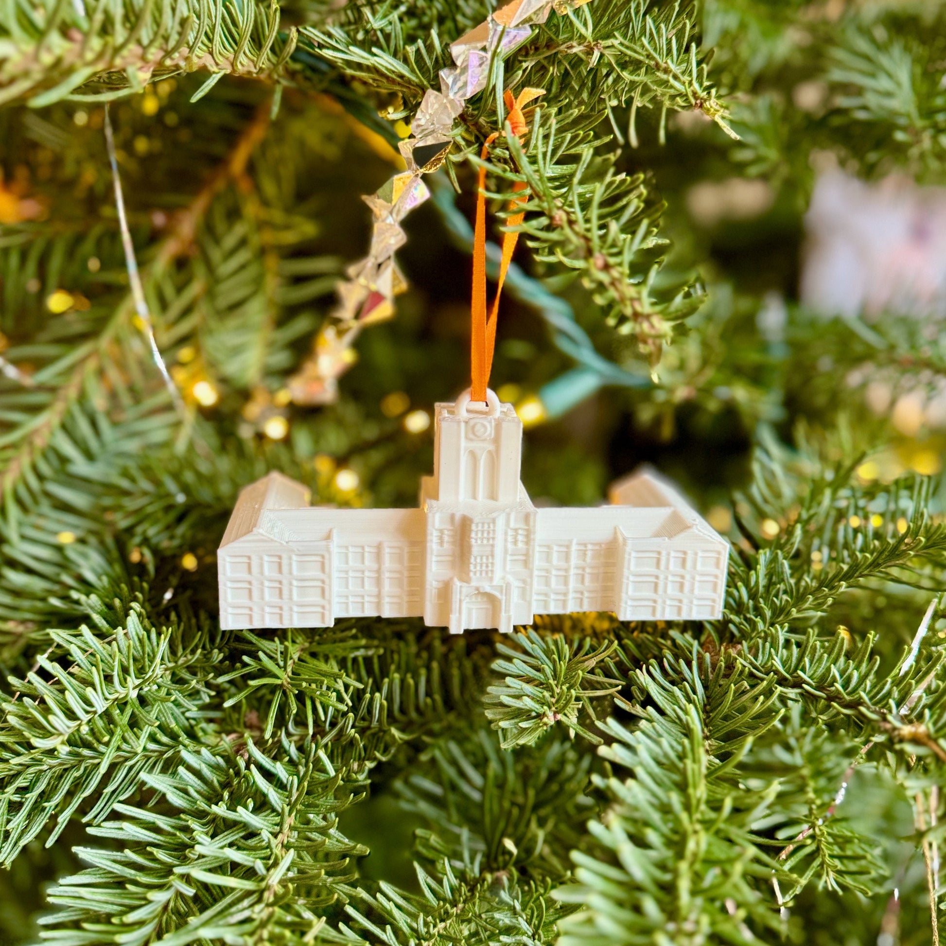 The University of Tennessee Ayres Hall ornament, shown on a Christmas tree decorated for the holidays.