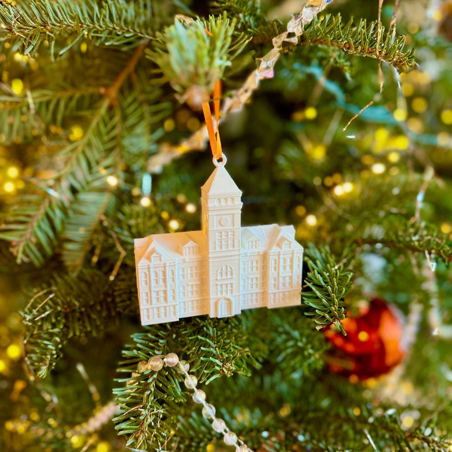 The 3D printed Clemson University ornament, shown on a Christmas tree.