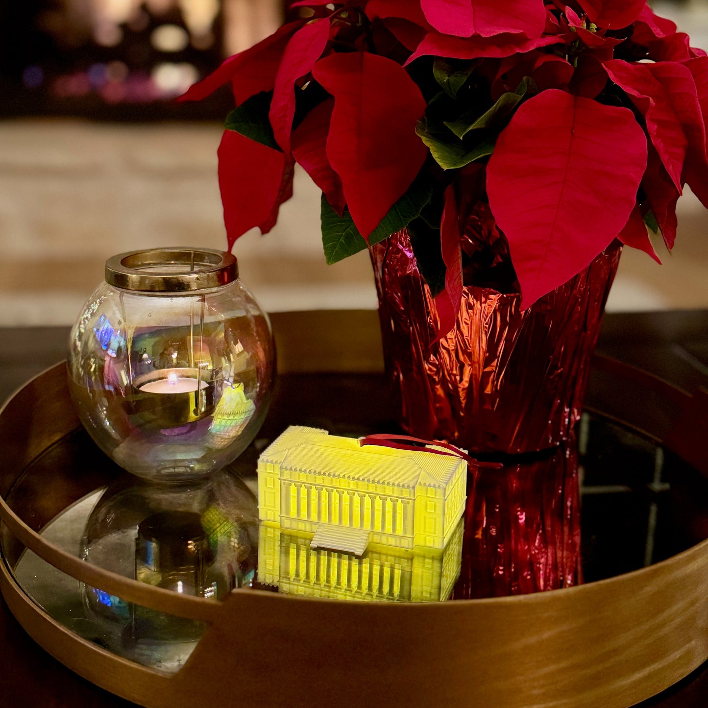 The lighted Texas A&M ornament, shown on a living room table decorated for Christmas.