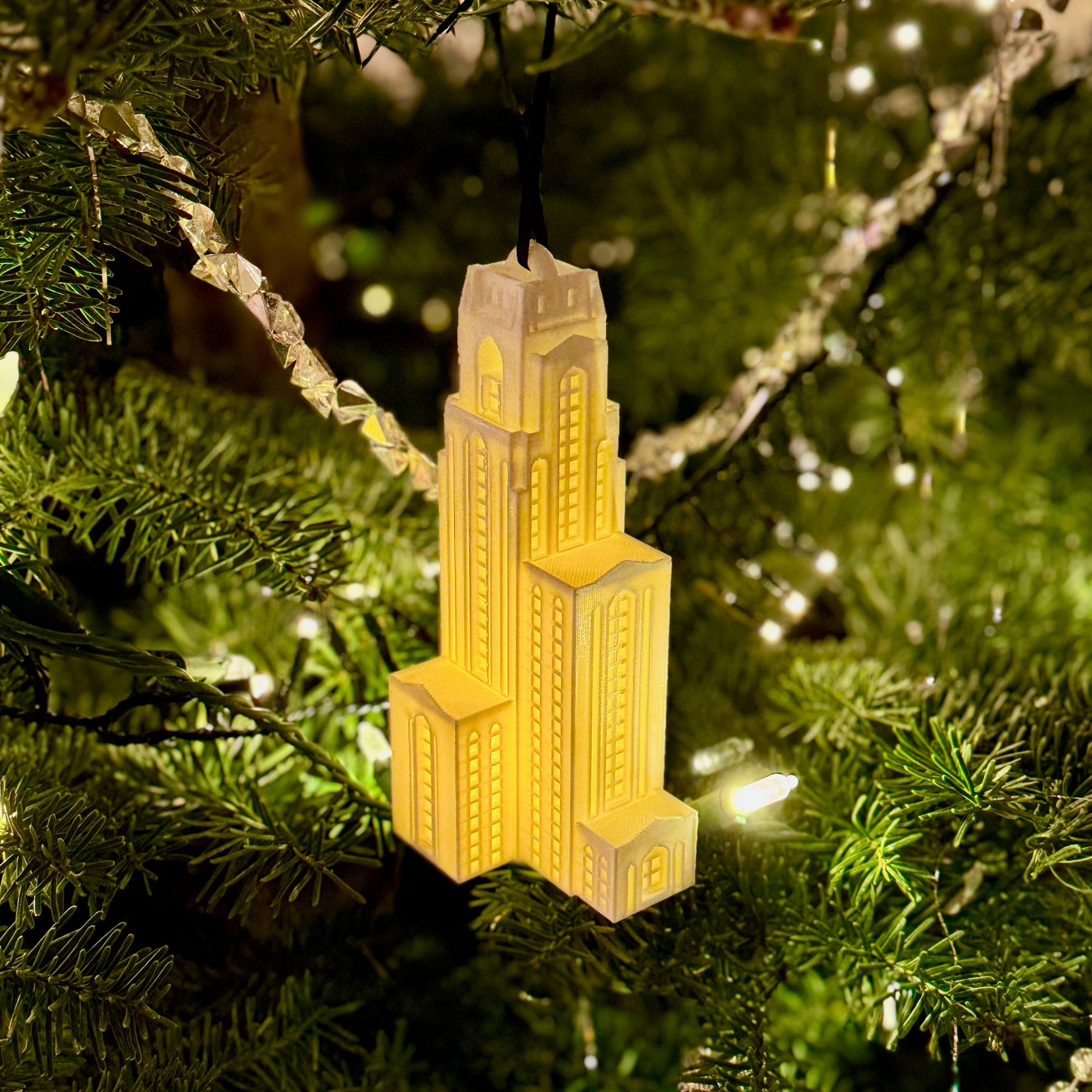 The lighted Pitt Cathy ornament, shown on a Christmas tree decorated for the holidays.