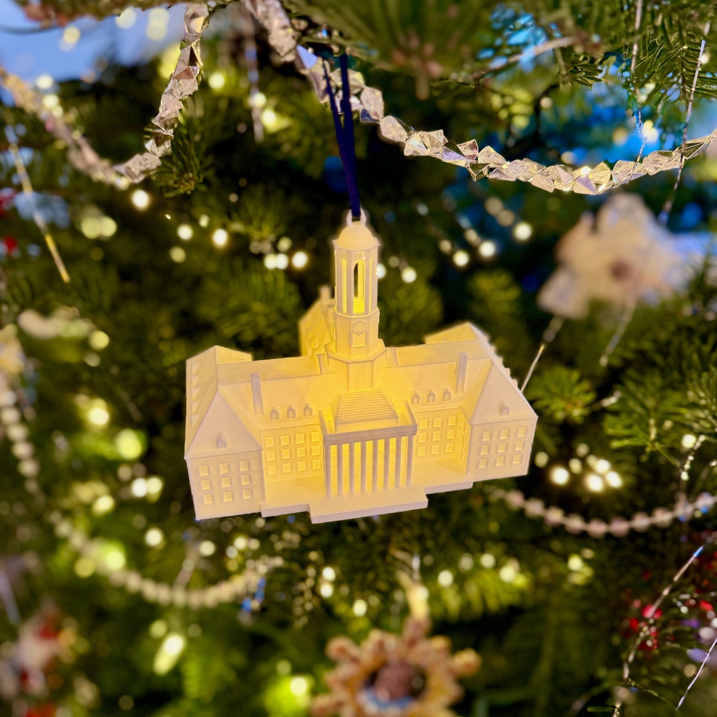 The Penn State lighted ornament, showing the Penn State Old Main building.