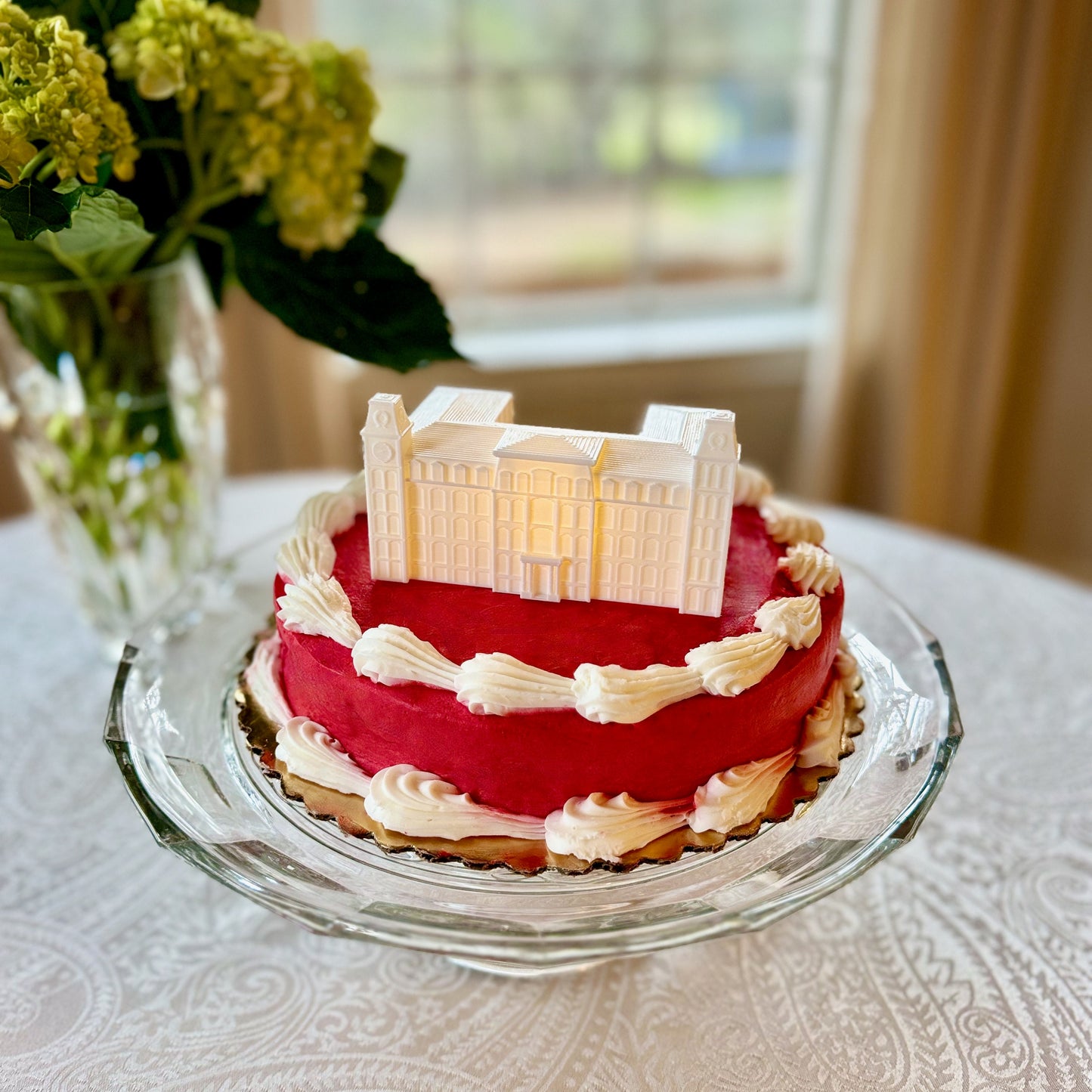 The University of Arkansas cake topper, shown on a red Arkansas graduation cake.