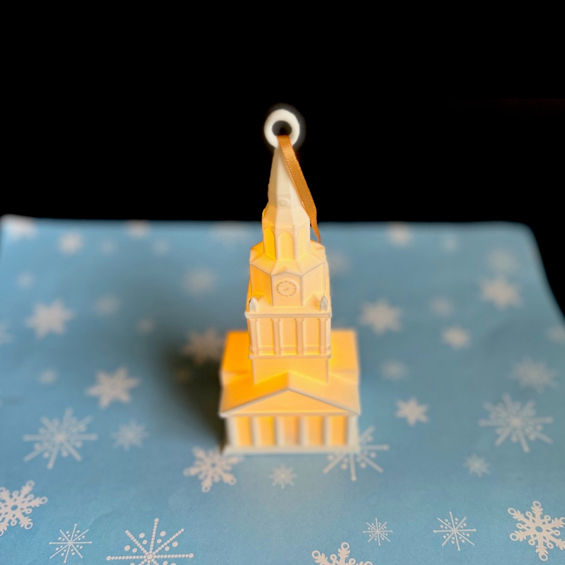 The Wake Forest Christmas ornament, shown against a holiday background.