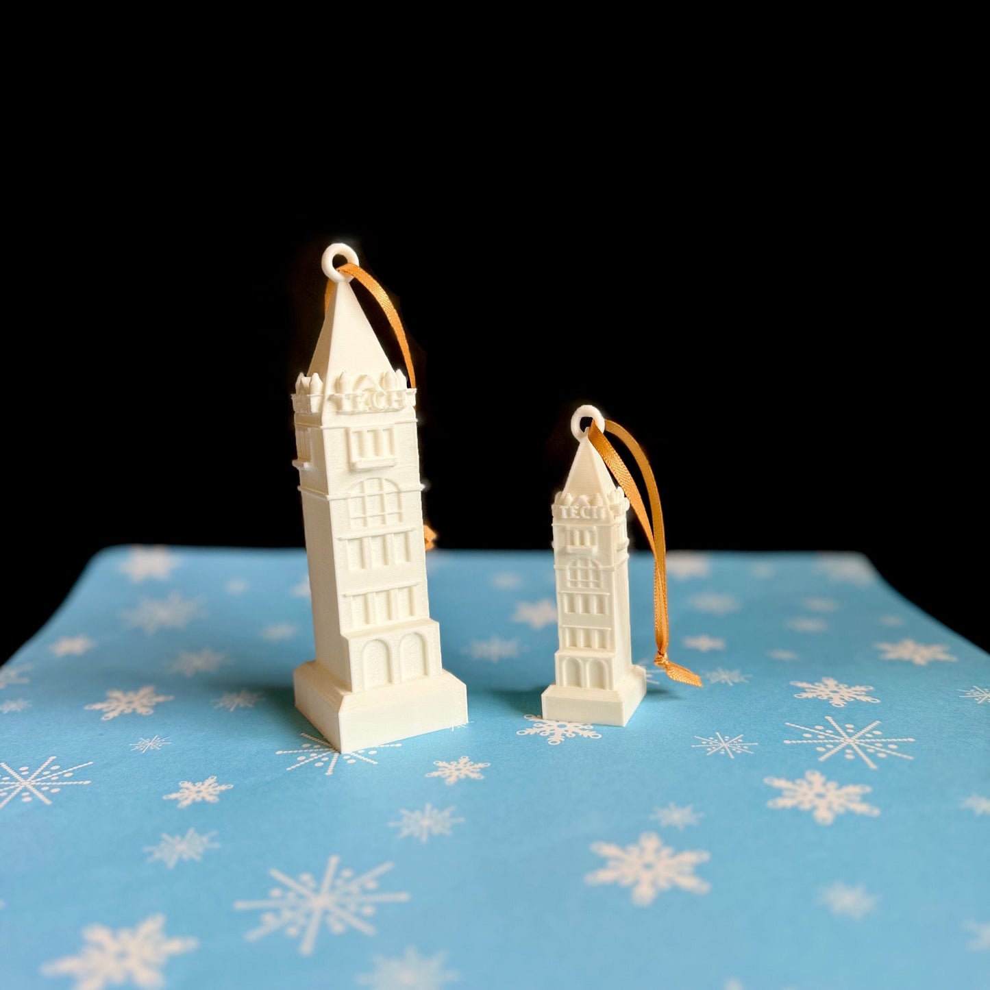 Georgia Tech Tower ornaments, shown against a Christmas background.